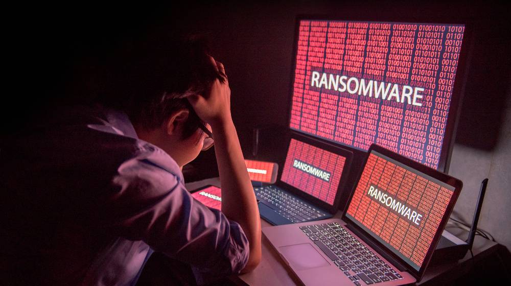 Young Asian male frustrated, confused and headache by ransomware attack | US To Stop Ransomware Attacks By Cracking Down on Crypto | featured
