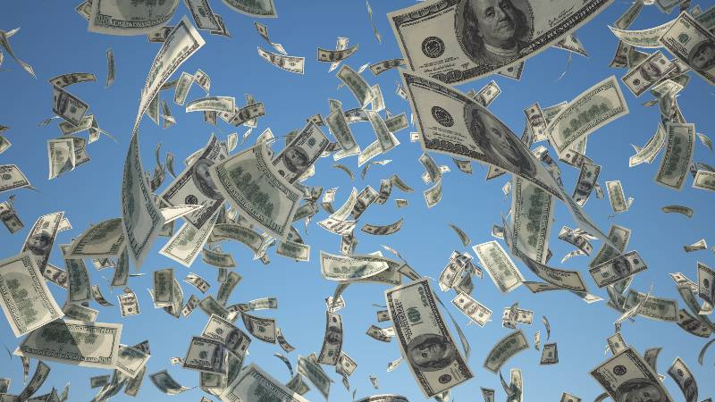100 US Dollar, bills flying on blue sky background-Trillion