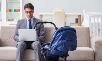 Businessman looking after newborn baby at home and teleworking | Palantir Exec Calls Men Who Take Long Paternity Leave ‘Losers’ | featured
