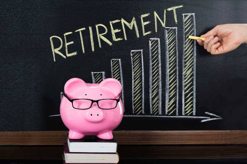 Close-up Of Retirement Saving Concept On Blackboard-Retirement Savings