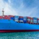 Container cargo ship import export global business worldwide logistic and transportation | Shipping Crisis Forces Retailers To Get Own Cargo Vessels | featured