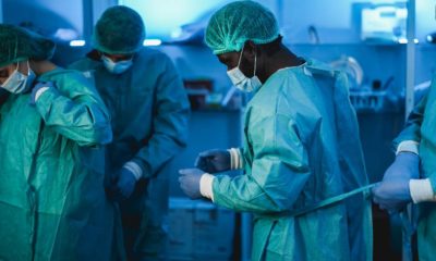 Doctors at work inside hospital during coronavirus outbreak - Medical worker on Covid-19 crisis wearing face protective mask | US Hospitals Struggle As Delta Surges But Stimulus Runs Out | featured