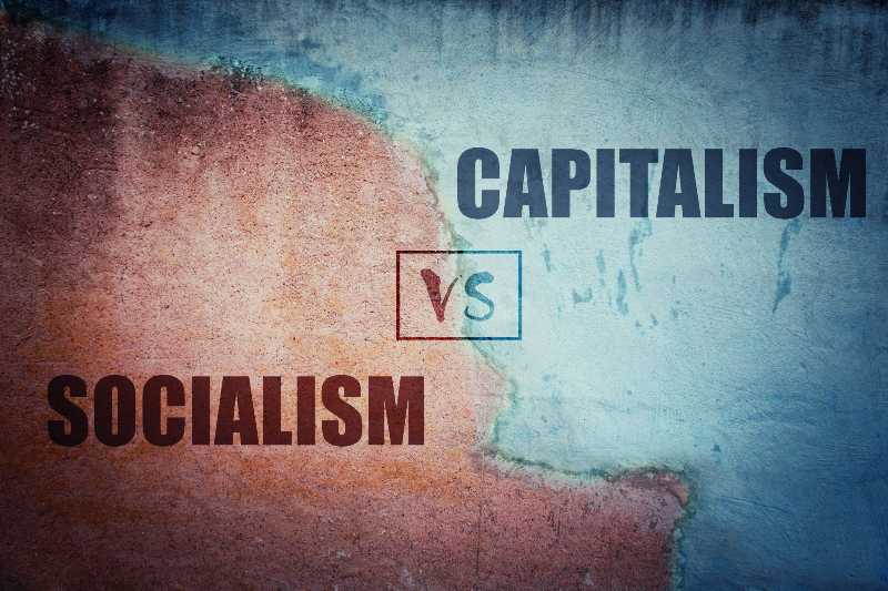 Socialism versus capitalism split concrete wall cracked in two different halves-Capitalism Vs Socialism