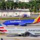 Southwest Airlines 737 and American Airlines 737 at FLL. Fort Lauderdale | Texas-based Airlines Defy Abbott’s Ban on Vaccine Mandates | featured