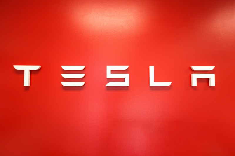 TESLA sign on the wall inside a Tesla store-Tesla Headquarters