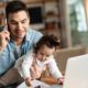 Young working father talking on the phone while babysitting his playful daughter at home | MIT Prof: Good Luck Getting WFH Employees Back to the Office | featured