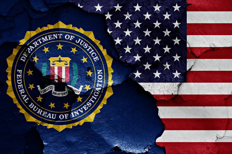 flag of FBI and USA painted on cracked wall-FBI