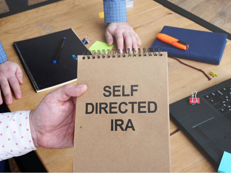 Business photo shows hand written text -self directed-self directed ira