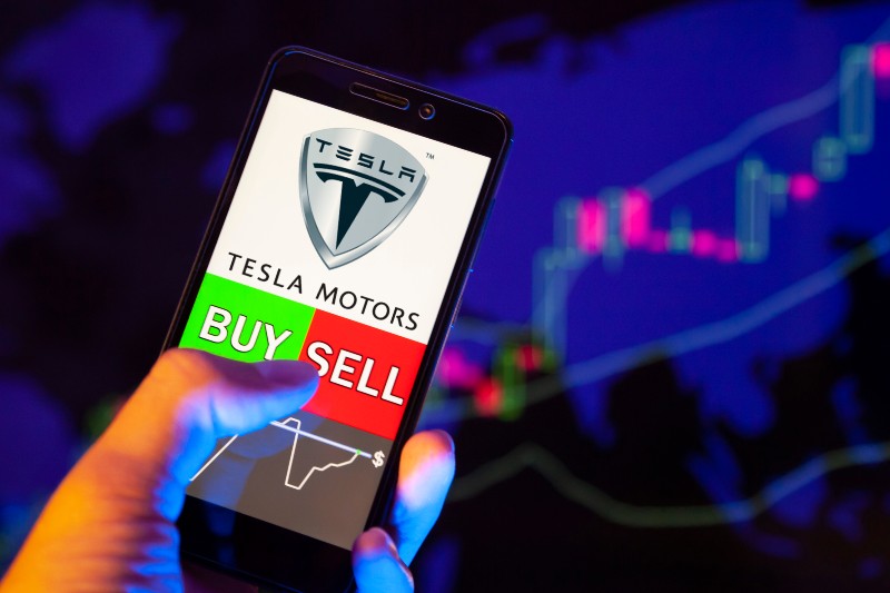 Company logo Tesla Motors on smartphone screen-Sell Tesla Stock