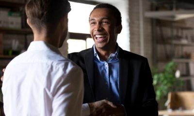 Happy black ceo handshaking rewarding successful worker | Why Leaders Must Earn The FAITH Of Their Stakeholders? | featured