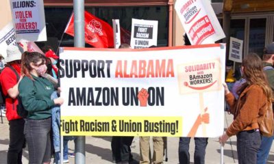 Unidentified participants protesting Amazon's treatment of employees and their attempts to bust up formation of a union for workers | Amazon Workers In Alabama To Vote Again For A Union | featured