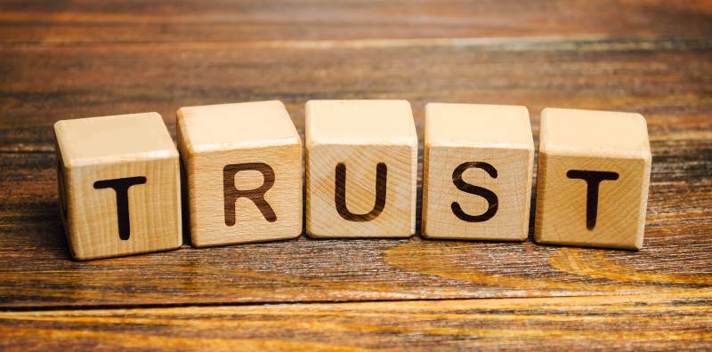 Wooden blocks with the word Trust-Culture Built on Trust
