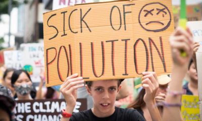 Youth Global Climate Strike with signs about climate crisis | ‘End of Coal in Sight’ as COP26 Deals Take Aim At Dirtiest Fuel | featured
