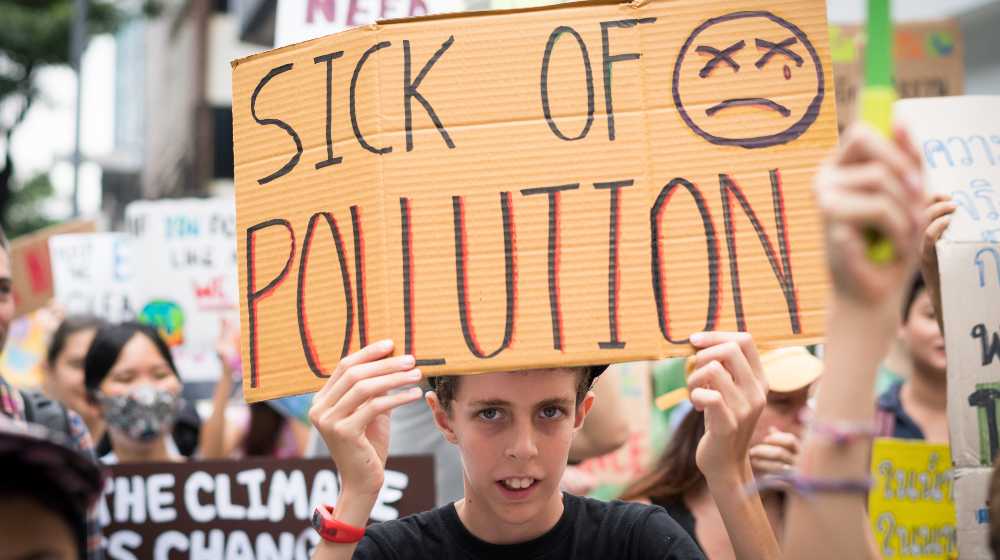 Youth Global Climate Strike with signs about climate crisis | ‘End of Coal in Sight’ as COP26 Deals Take Aim At Dirtiest Fuel | featured
