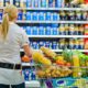 a woman is overwhelmed with the wide range in the supermarket | Fed’s Kashkari Says US Inflation Rate to Keep Going Up | featured