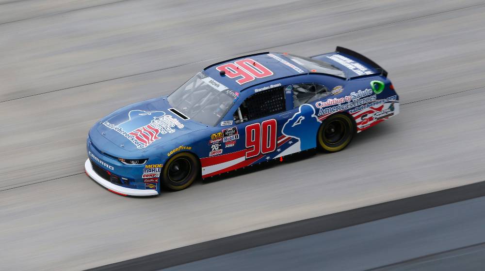 Brandon Brown (90) takes to the track to practice for the Bar Harbor 200 | ‘Let’s Go Brandon!’ Driver Brandon Brown Says Sponsors Avoiding Him | featured