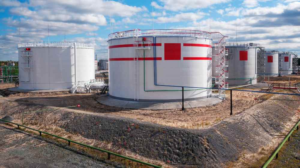 Cloudy day. Tanks with oil for further transportation of oil through pipes | In Historic Move, US Strategic Petroleum Reserve to Release a Record 50M Barrels | featured