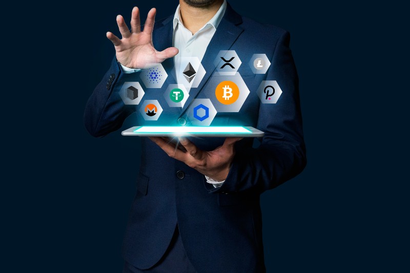 Cryptocurrency altcoin, Business man holding tablet showing growing virtual hologram of altcoin crypto and bitcoin | Invest In Crypto
