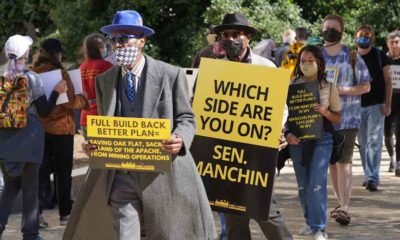 Protesters at the Hart Senate Office Building carry signs calling for Sen. Manchin to support the full Build Back Better Bill | Manchin Won’t Support Democrat’s $2T Build Back Better Program | featured
