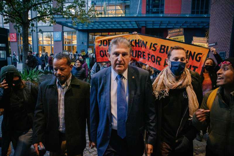 Senator Joe Manchin is confronted by climate activists leaving his boat | Build Back Better