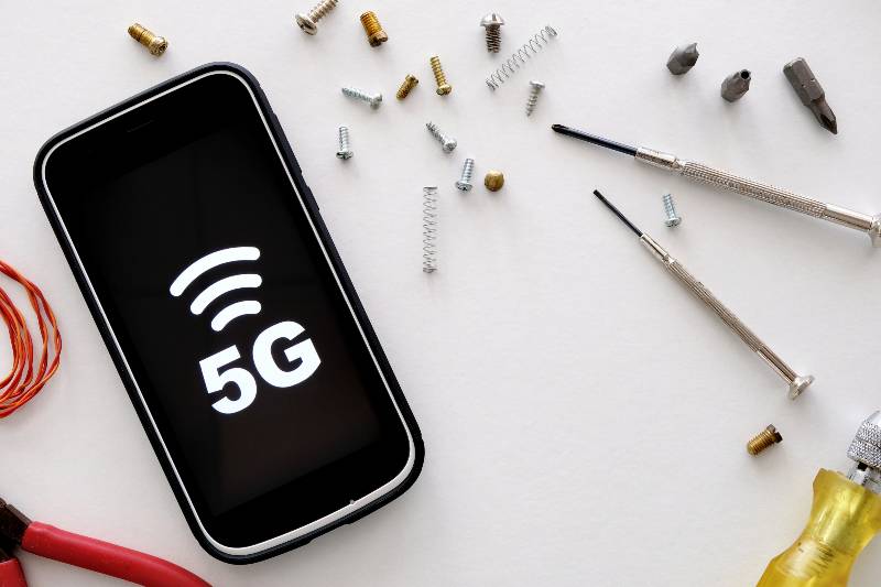A smartphone displaying 5G symbol | 5G services rollout