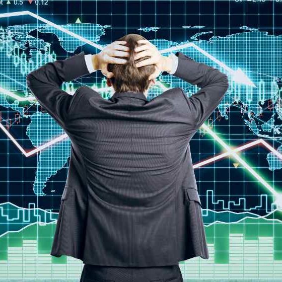 Businessman grabs the head concept with business chart | US Stocks Retreat As Fed Plans to Reduce Balance Sheet | featured