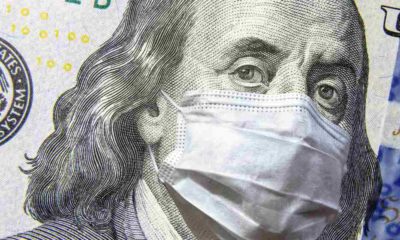COVID-19 coronavirus in USA, 100 dollar money bill with face mask | US Economy Went Up By 5.7%, But Inflation Still Very High | featured