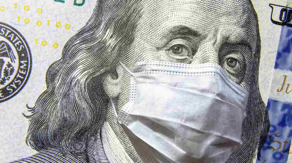 COVID-19 coronavirus in USA, 100 dollar money bill with face mask | US Economy Went Up By 5.7%, But Inflation Still Very High | featured
