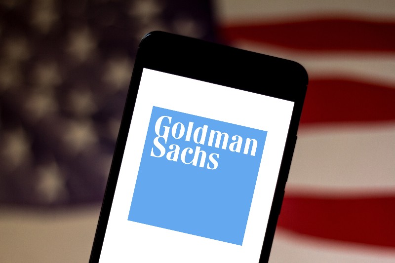Goldman Sachs Group logo is displayed on a smartphone | Hike Interest Rates