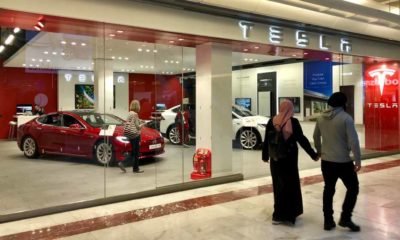 Model S and Roadster vehicles on display inside a Tesla Motors Store | Tesla Sales Set Record-Breaking Performances in 2021 | featured