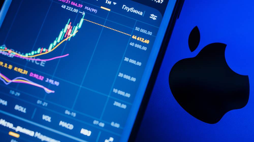 The Apple logo on the background of a stock exchange | Apple Becomes First Company With $3 Trillion Market Cap | featured