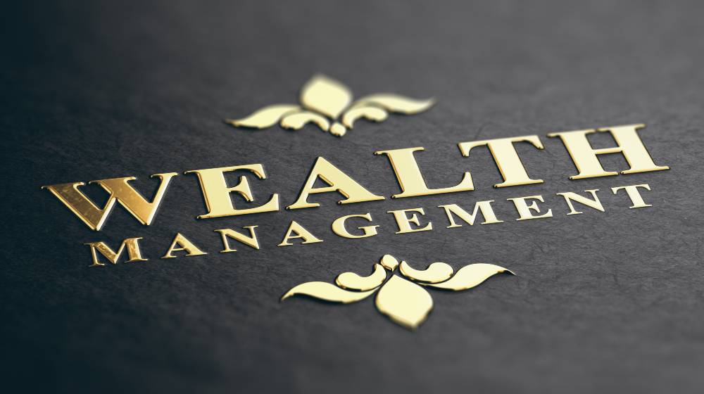 Wealth management phrase embossed | What Is The Difference Between Investment Management And Wealth Management? | featured