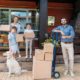 family with cardboard boxes and labrador dog | 600,000 People Left New York and California For Lower Tax States Such As Florida and Texas | featured