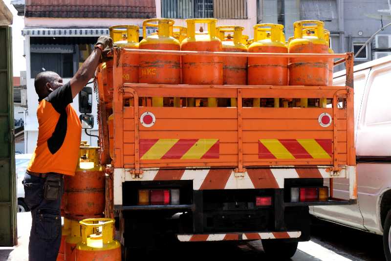 A man unloading canisters of cooking gas from a supply truck parked on a side street | What’s Going on In the Labor Market?