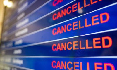 Airport screen indicating cancelled flights | Massive Winter Storm Cancels Thousands of Flights Across US | featured