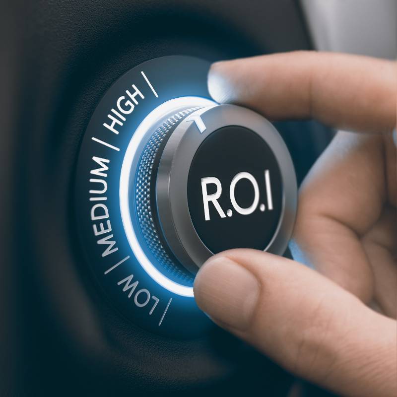 Hand turning knob to select high return on investment, black and blue tones. ROI Concept | What Kind of Returns Might Investors Reasonably Expect Over the Next Several Years?