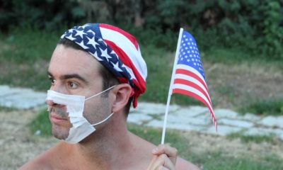 Protestor with broken surgical mask in the USA | States Ignore Biden, Lift School Mask Mandates | featured