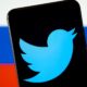 Twitter logo seen on the smartphone screen and blurred flag of Russia on the back | US Tech Firms Under Pressure To Take Hard Stance On Russia | featured