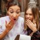 Two girls are surprised and shocked by the final bill for dinner at the restaurant. The concept of price increases and currency inflation | Are Corporations Using Inflation To Raise Prices Excessively? | featured