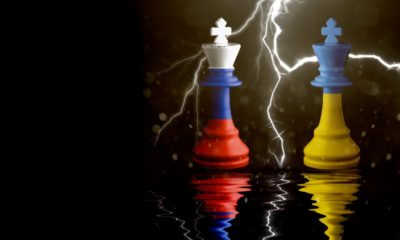 Ukraine and Russia flags paint over on chess king | Stock Futures Down, Oil Prices Up Due To Ukraine-Russia Crisis | featured