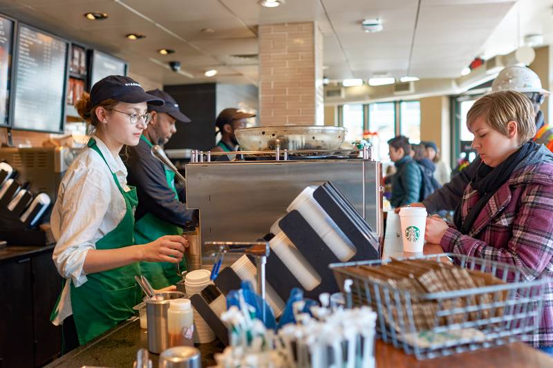 worker at Starbucks Cafe | Starbucks Workers in 54 Stores in 19 States Pushing For Union