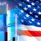 Barrels of oil next to the flag of the USA | Biden Wants Federal Oil Stockpile To Release 180M Barrels | featured