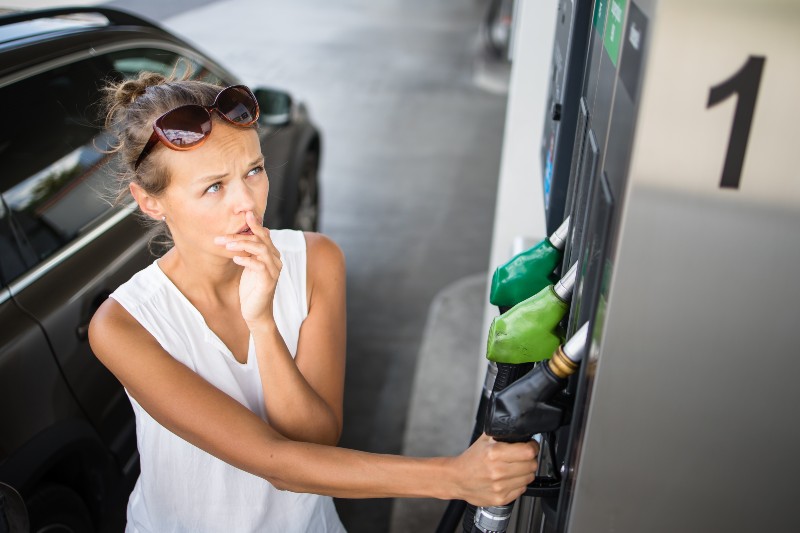 Car pumping gas at gas pump | National Average Gas Price Hit $4.009