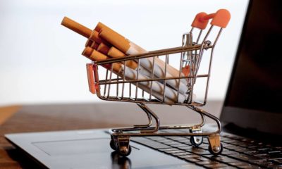 Cigarettes placed in supermarket shopping cart | Walmart Stops Cigarette Sales In Selected Stores | featured