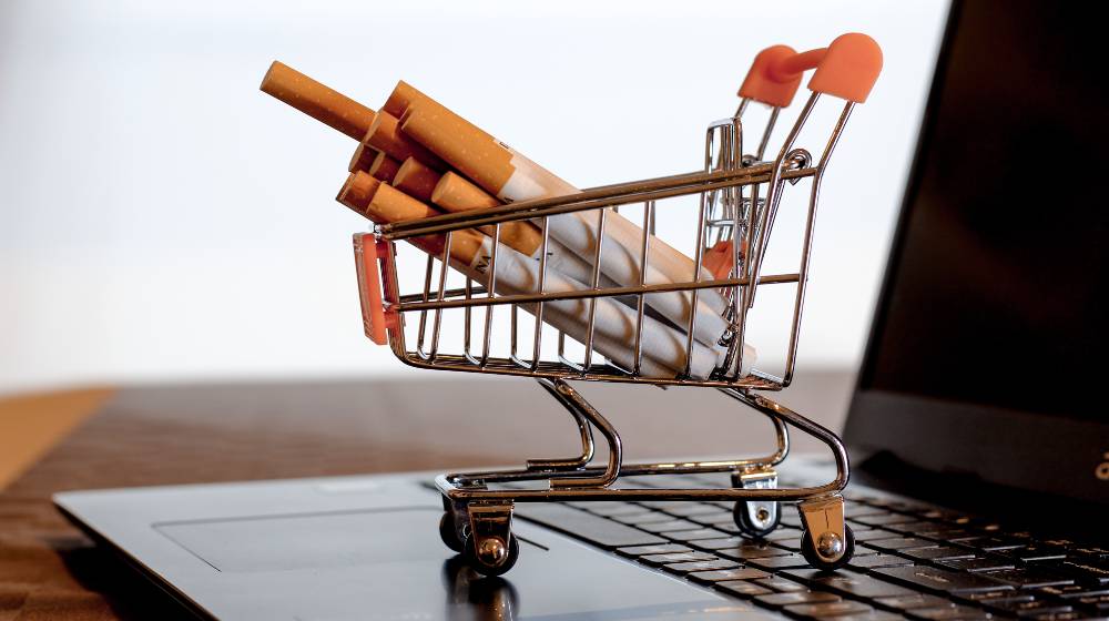 Cigarettes placed in supermarket shopping cart | Walmart Stops Cigarette Sales In Selected Stores | featured