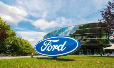 Ford logo on a company building | Ford’s Auto Business Will Split Into Two Separate Units | featured
