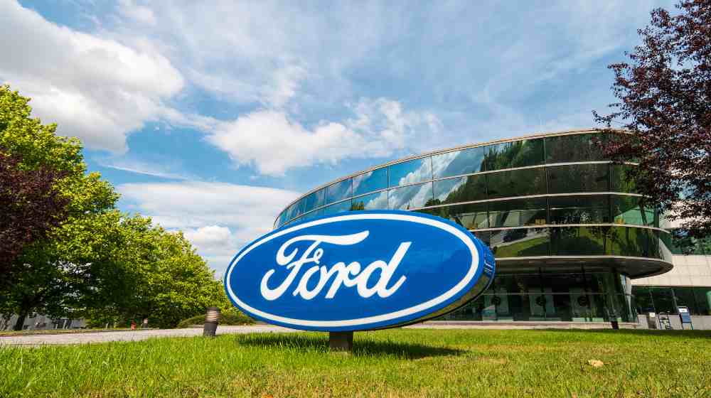 Ford logo on a company building | Ford’s Auto Business Will Split Into Two Separate Units | featured