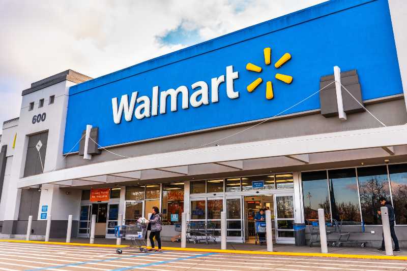 People shopping at a Walmart store | Walmart Joins Target and CVS Health In Ending Cigarette Sales
