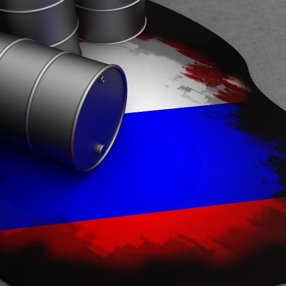 oil waste and russian flag in it | West Faces $300 Per Barrel Prices If They Cut Off Russian Oil | featured