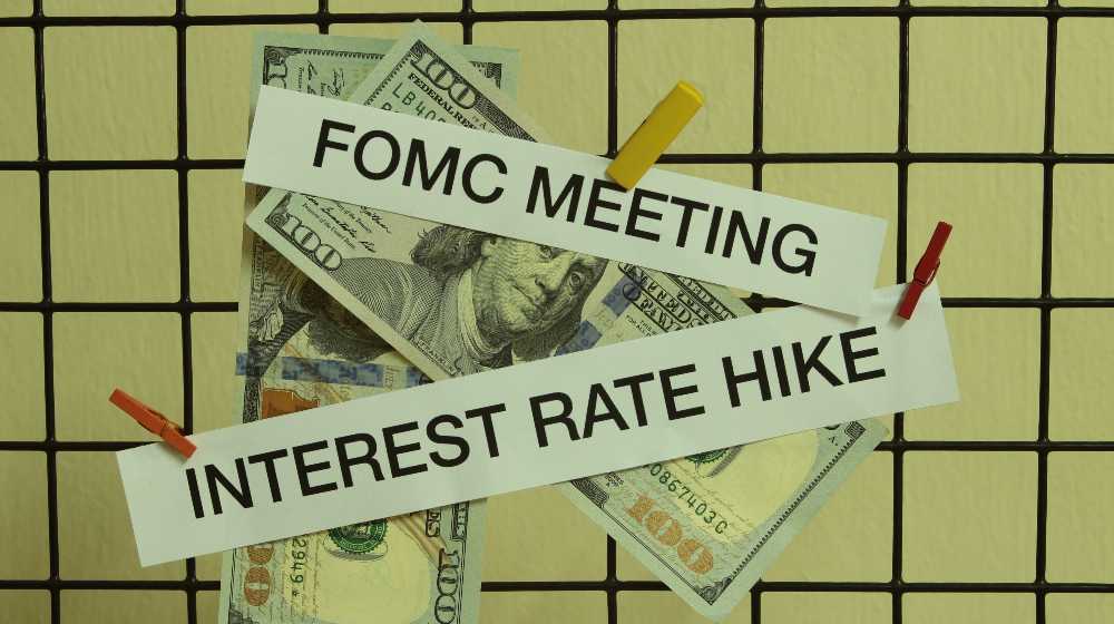 Iinterest rate hike and Fomc meeting on paper with dlooar bank note hang on sieve | Powell Hints At 50 Basis Points Hike In Interest Rates This May | featured